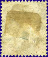 Multiple hinge remnants are visible on this stamp back
