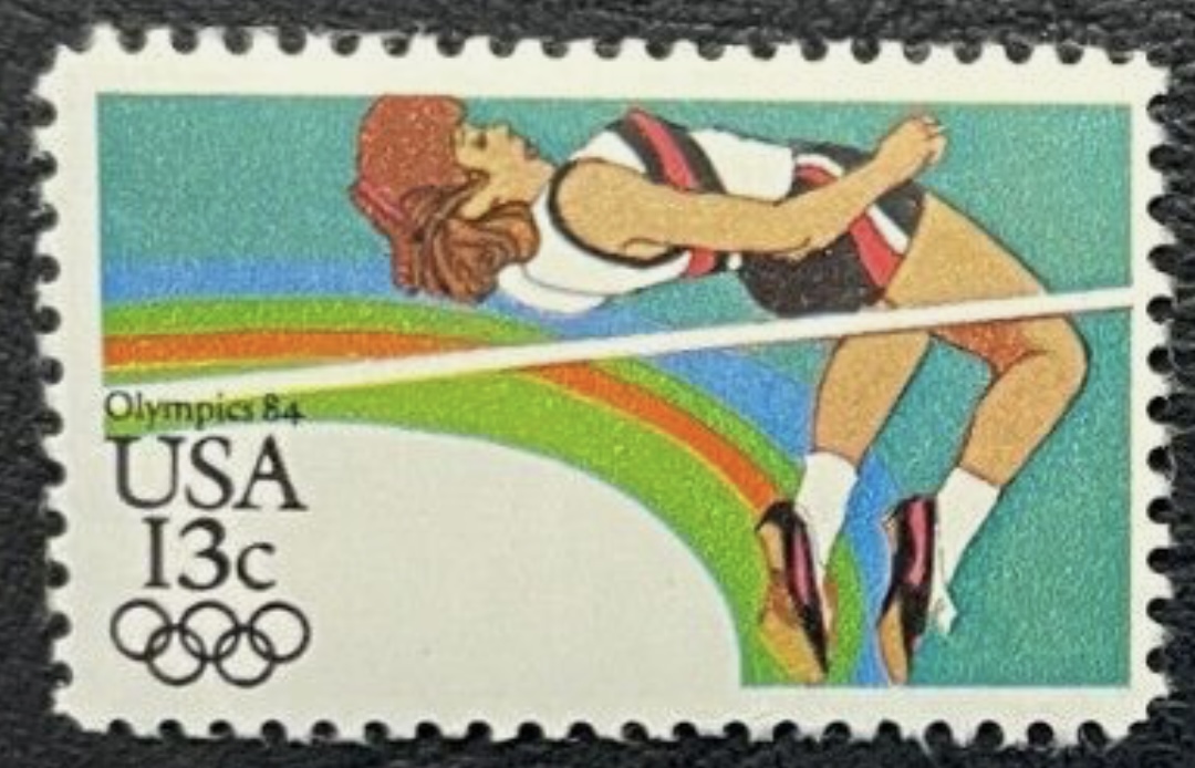 Summer Olympics Los Angeles, High Jumper 13c stamp (Scott #2049)