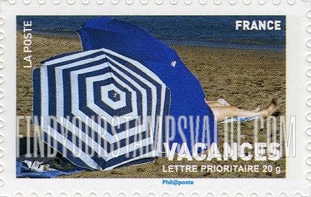 FindYourStampsValue: Vacations: Beach umbrellas and woman